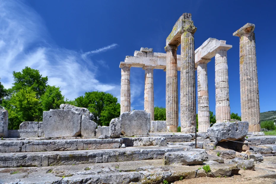 Temple of Zeus ruins at Ancient Nemea under clear skies.