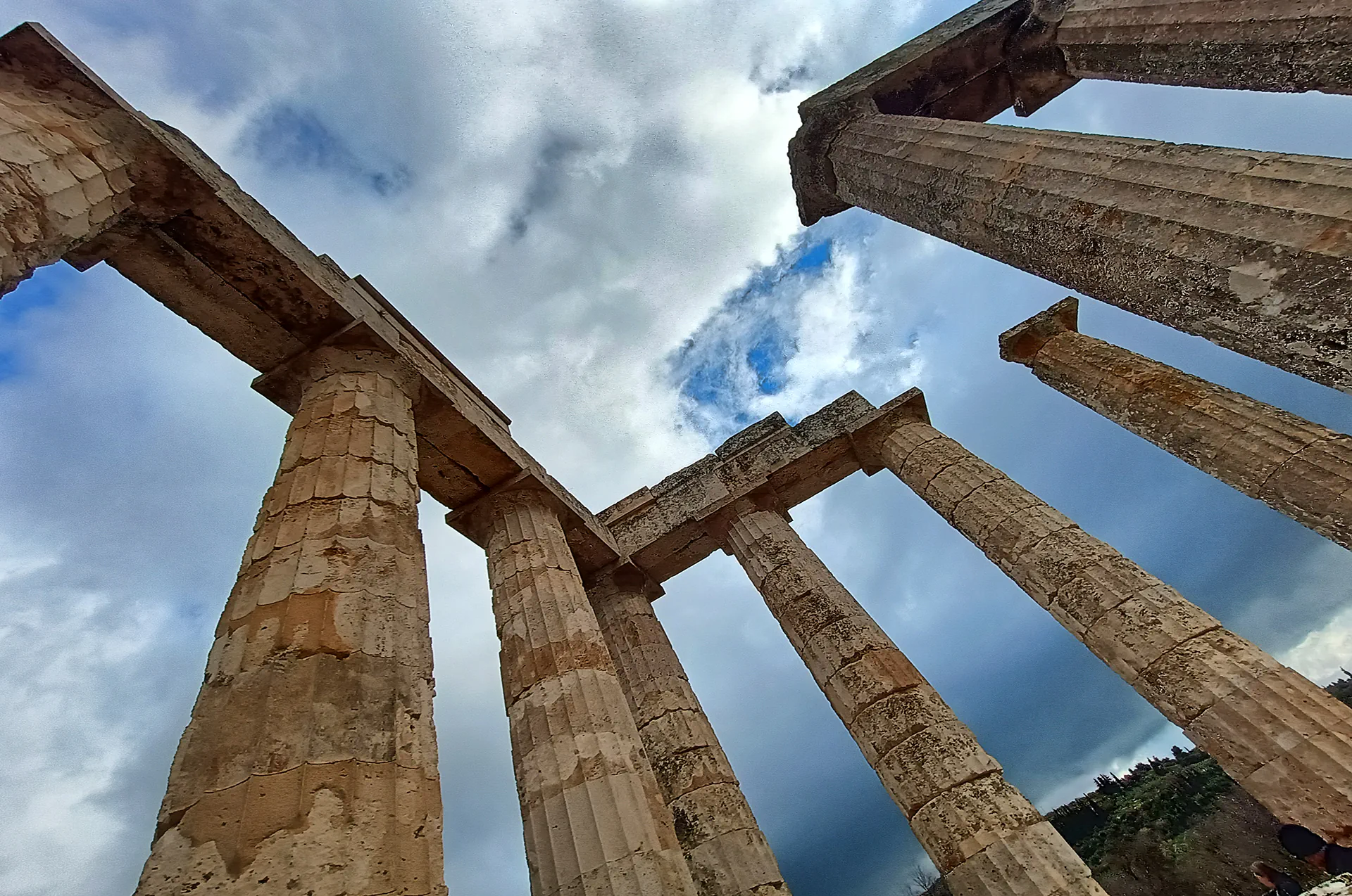 Temple of Zeus ruins at Ancient Nemea under clear skies.