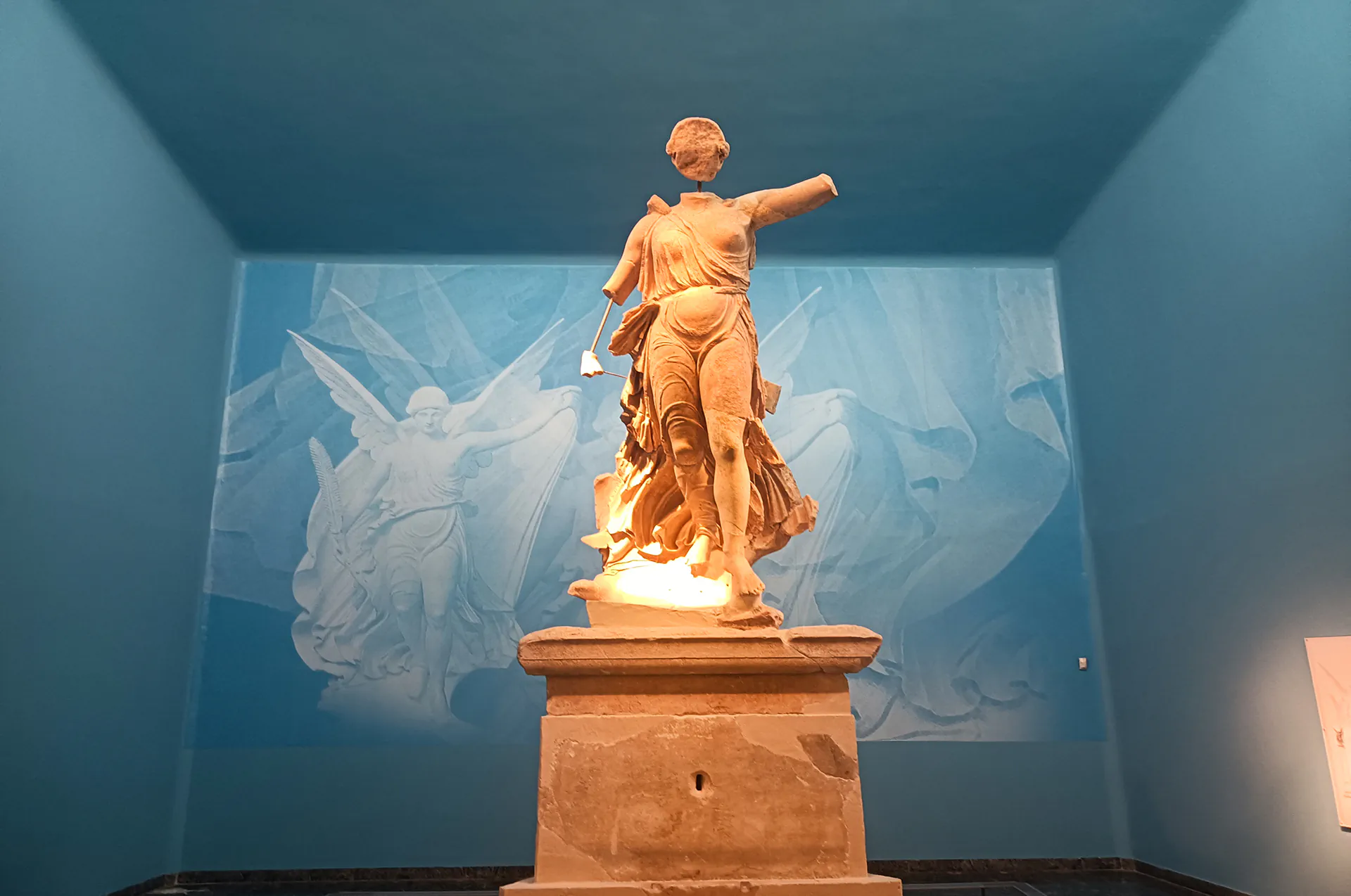 Artifacts and statues inside the Archaeological Museum of Olympia.