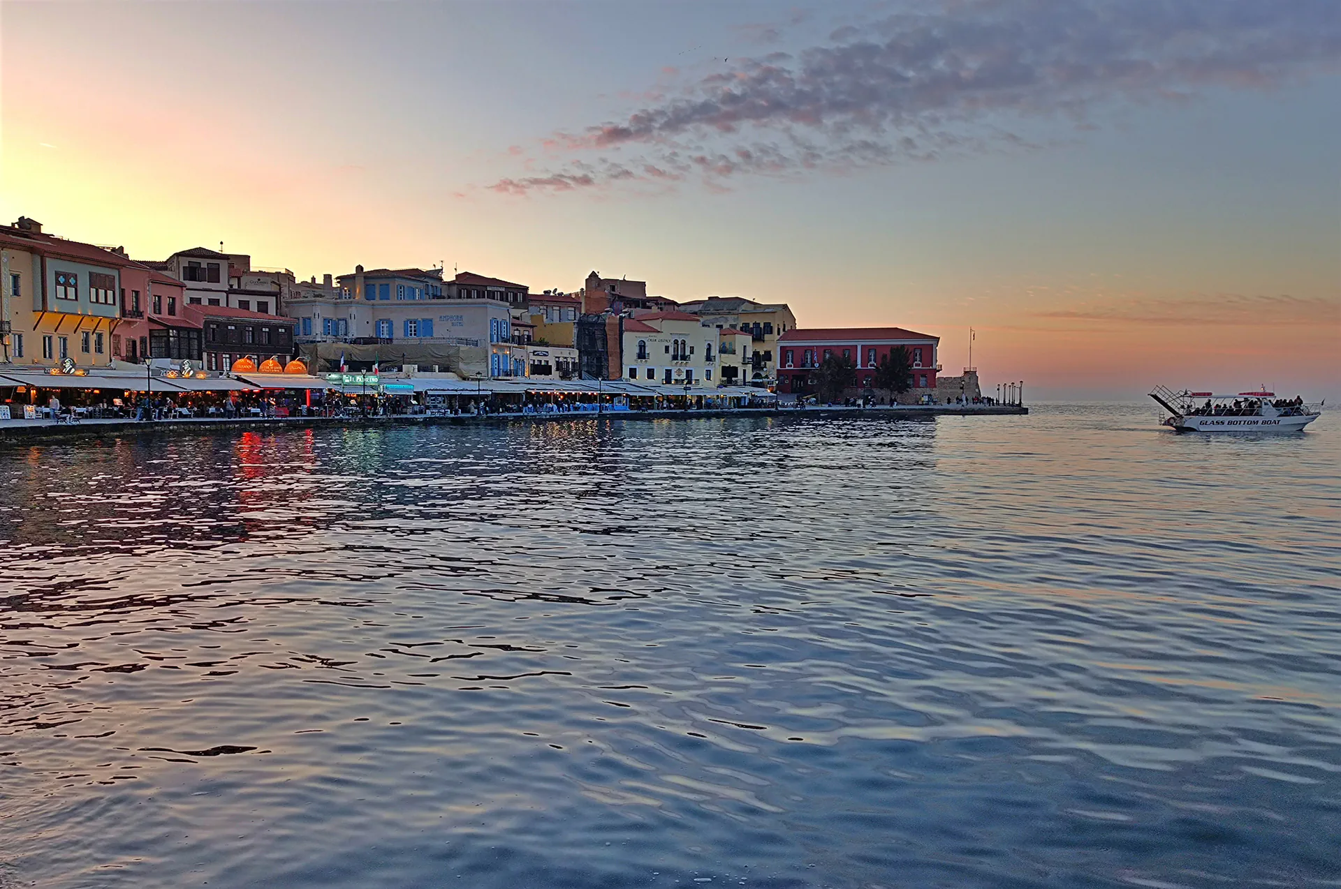 Sunset over the historic Chania port in Crete.