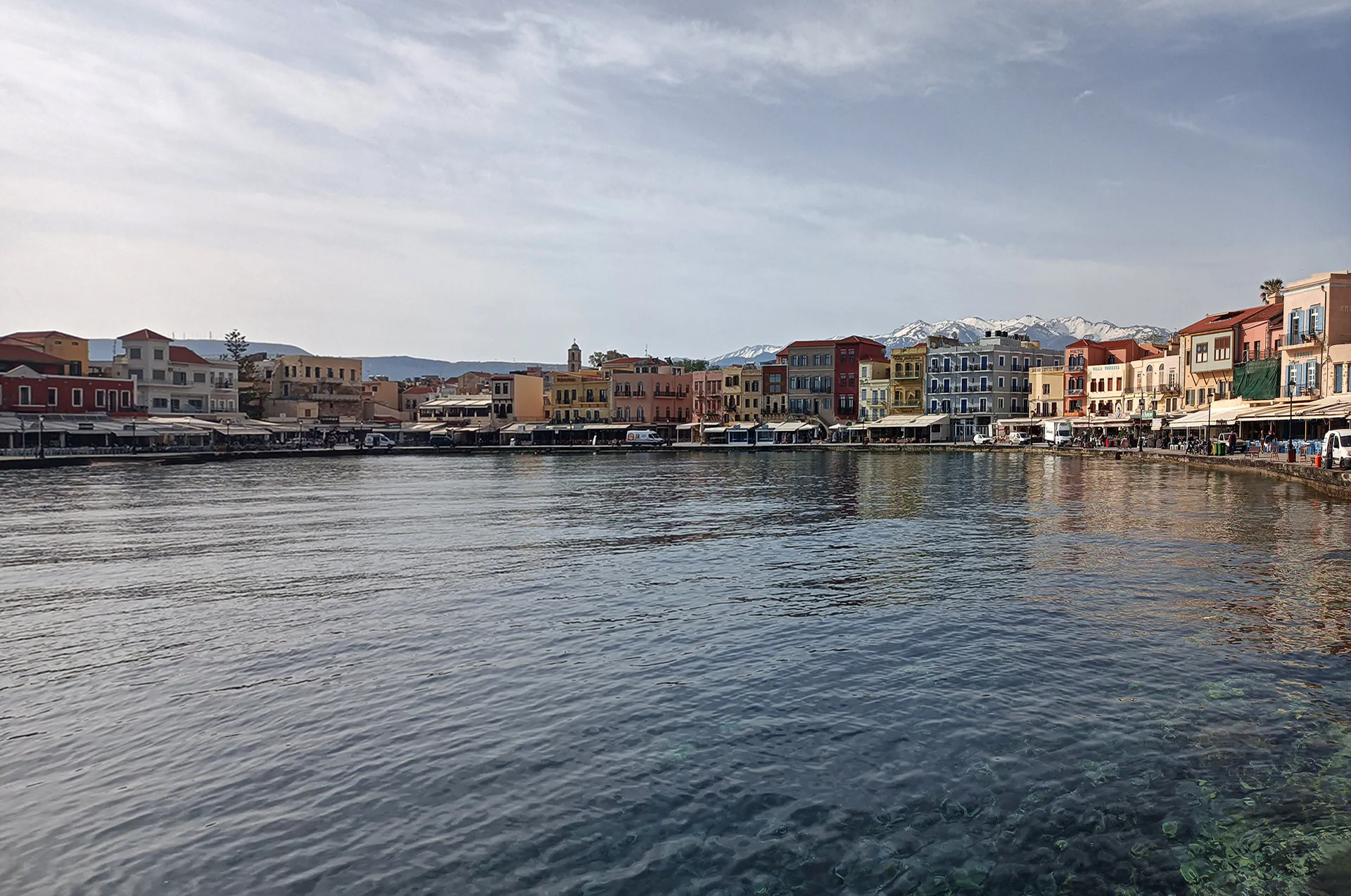Snow-capped mountains in the background of Chania, Crete, during winter.