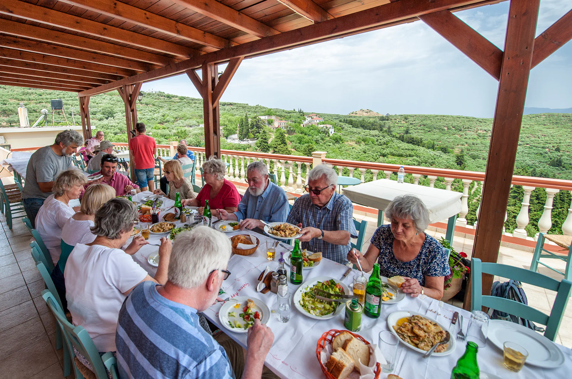 Guests enjoying traditional Cretan meal after cooking class in Chania.