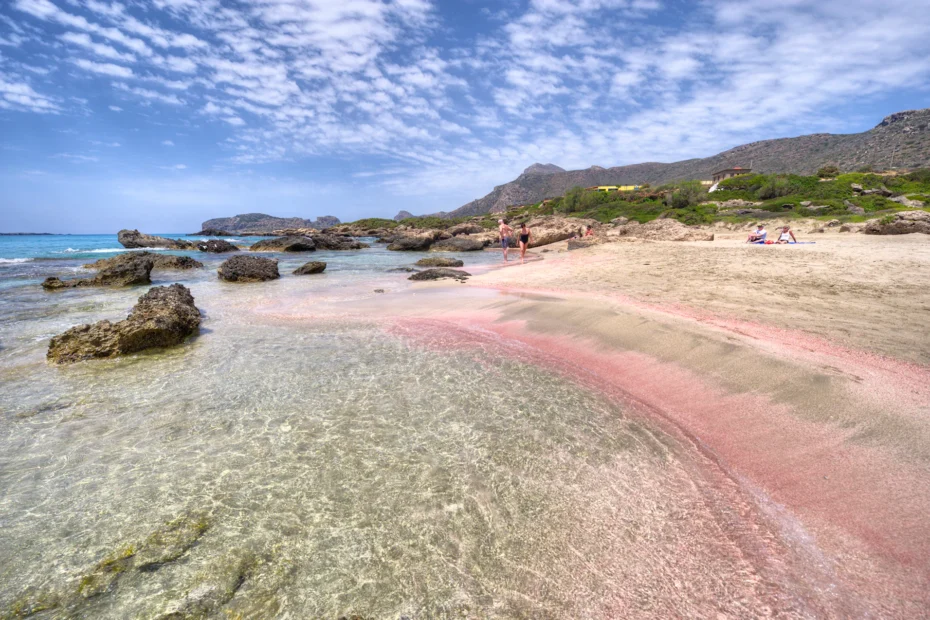 Crystal-clear waves gently hitting the sandy shore of Elafonissi Beach.