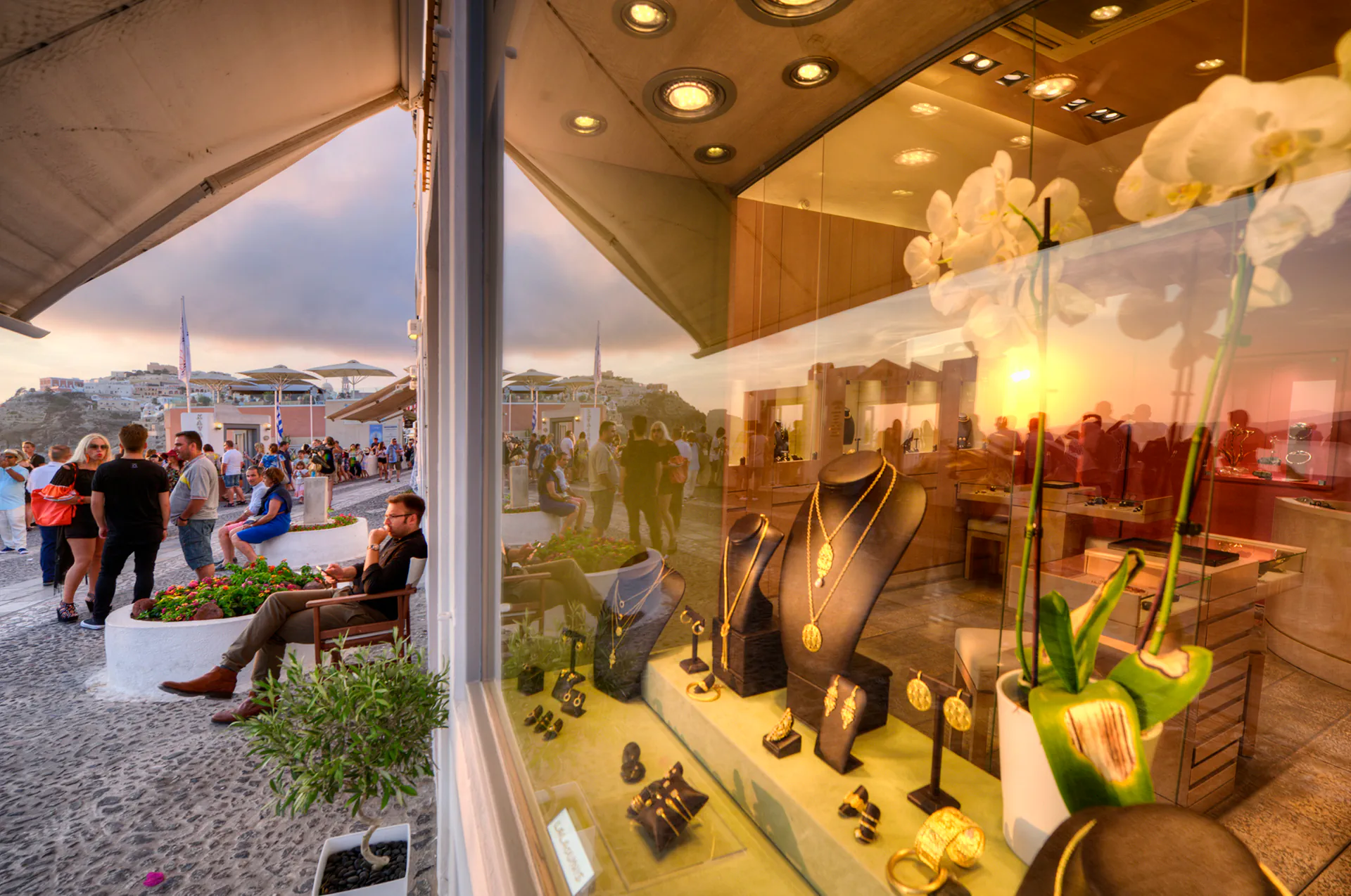 Boutiques and souvenir shops in Fira at sunset.