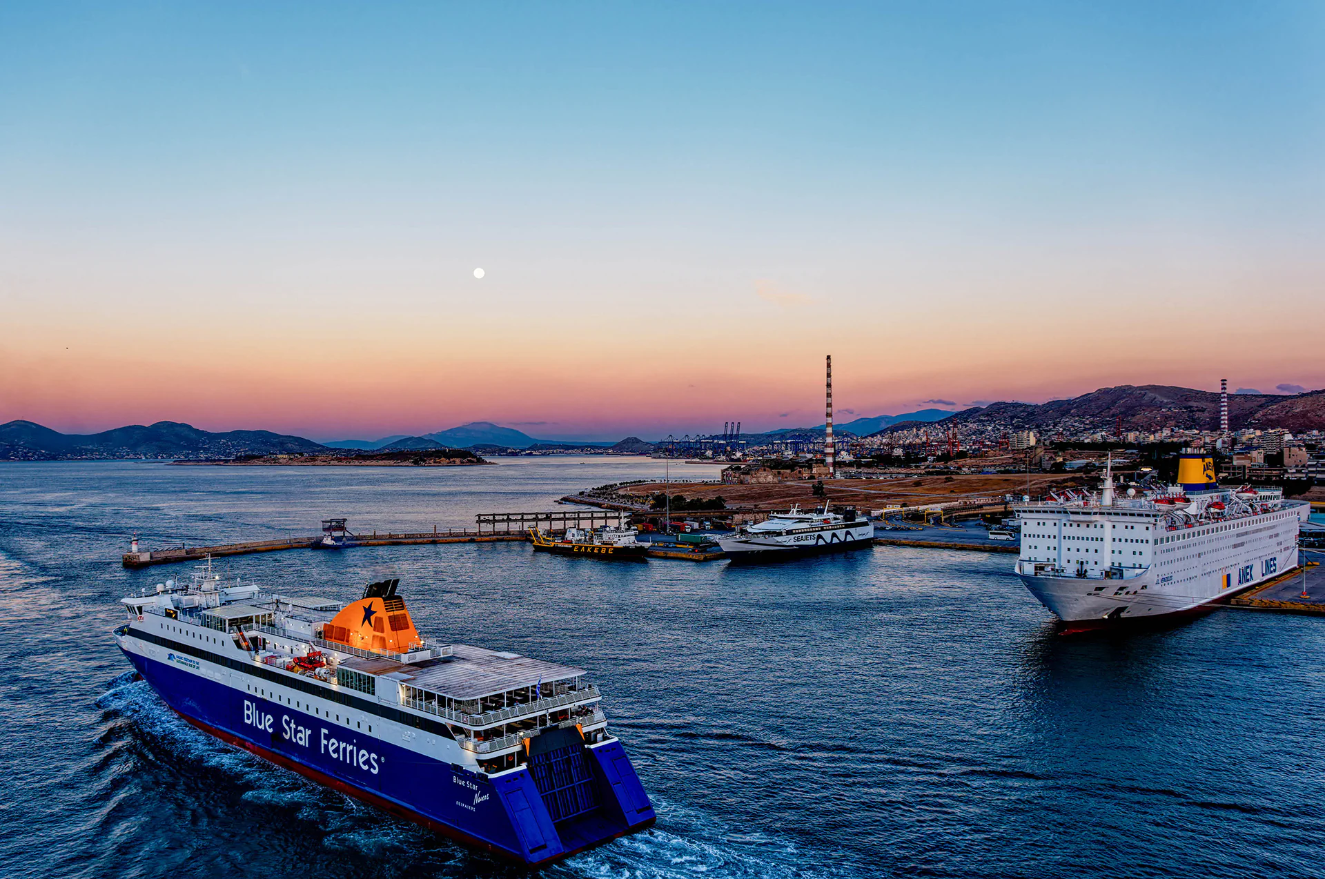 Greek ferry sailing across the sea at sunset