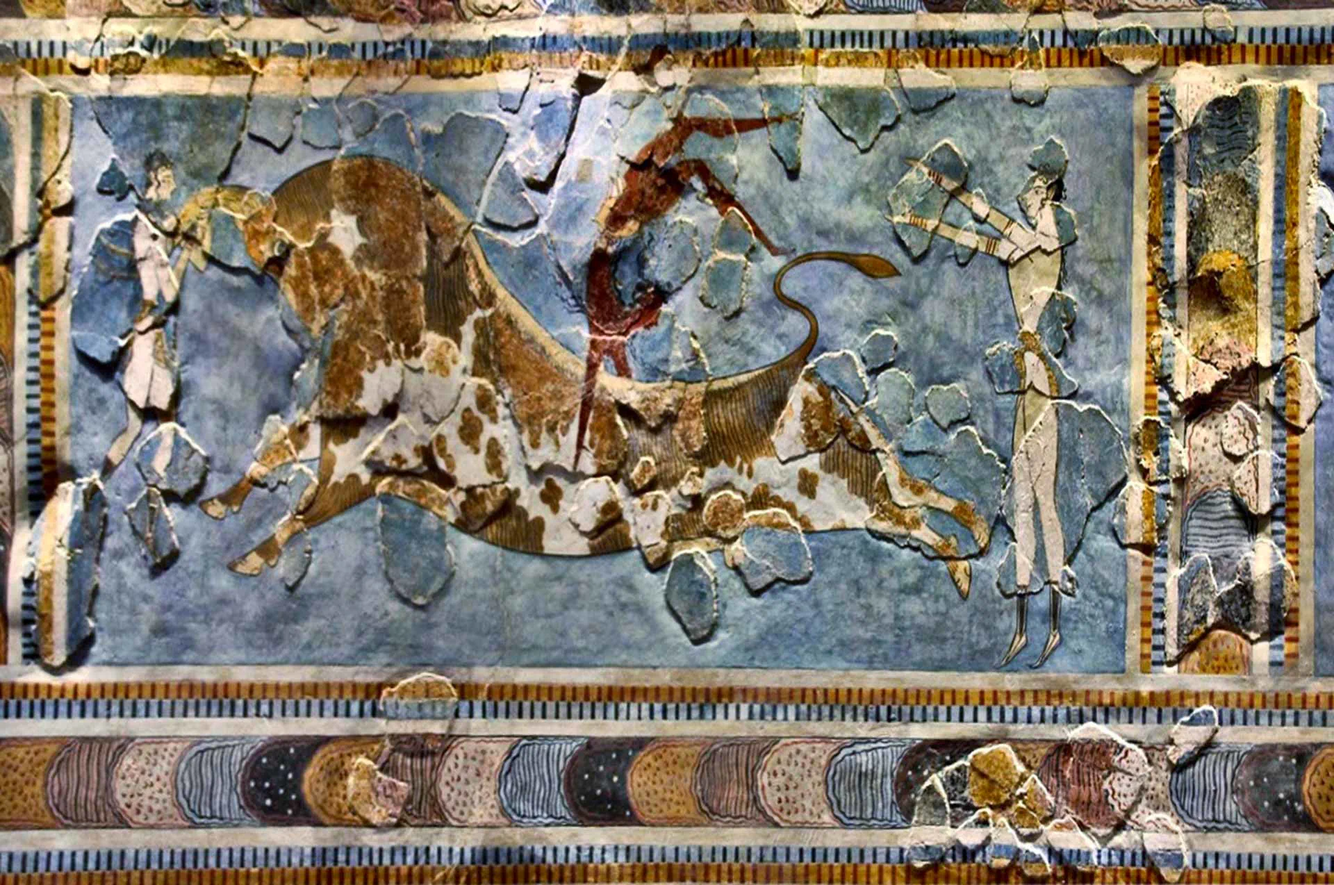 Colorful fresco depicting figures leaping over a bull, from Knossos palace.