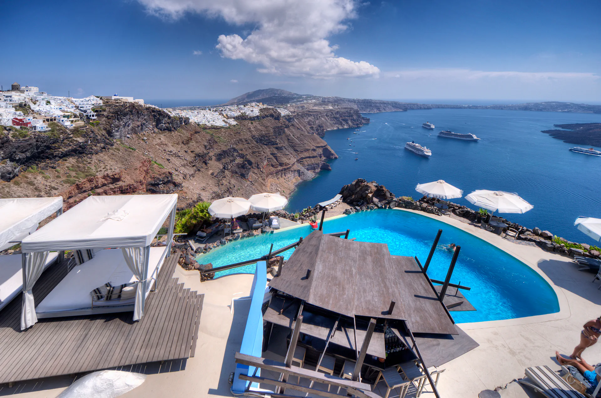 Luxury hotel pool overlooking the caldera in Imerovigli.