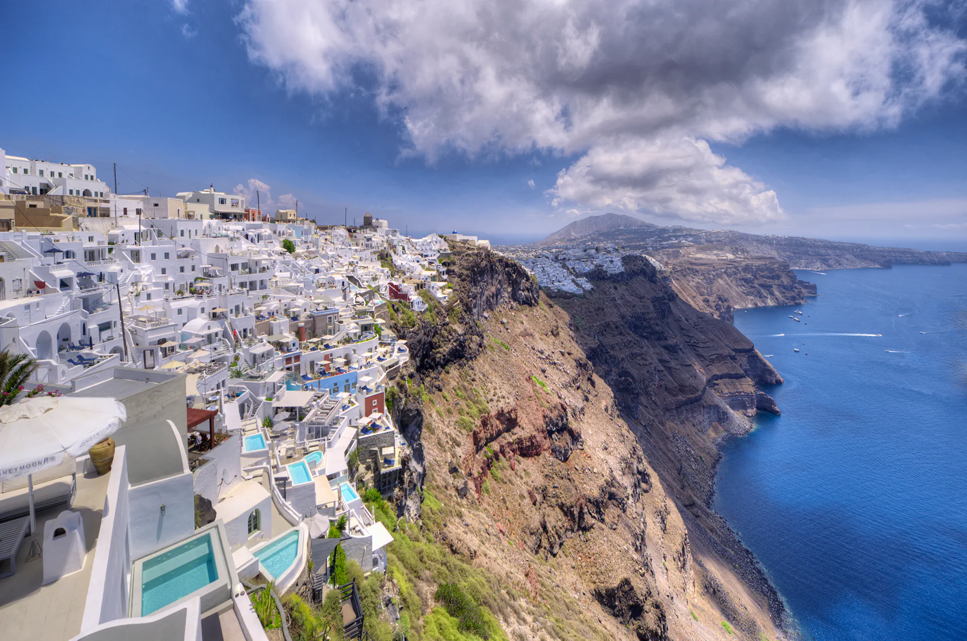Cliffside hotels and quiet paths in Imerovigli village.