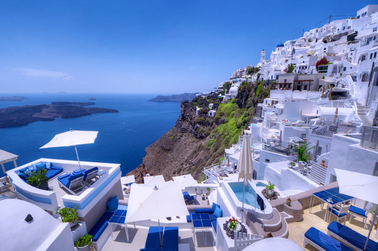 Classic Cycladic Architecture in Imerovigli Cycladic whitewashed houses in Imerovigli, Santorini, overlooking the amazing Aegean Sea, creating a stunning view of timeless beauty.