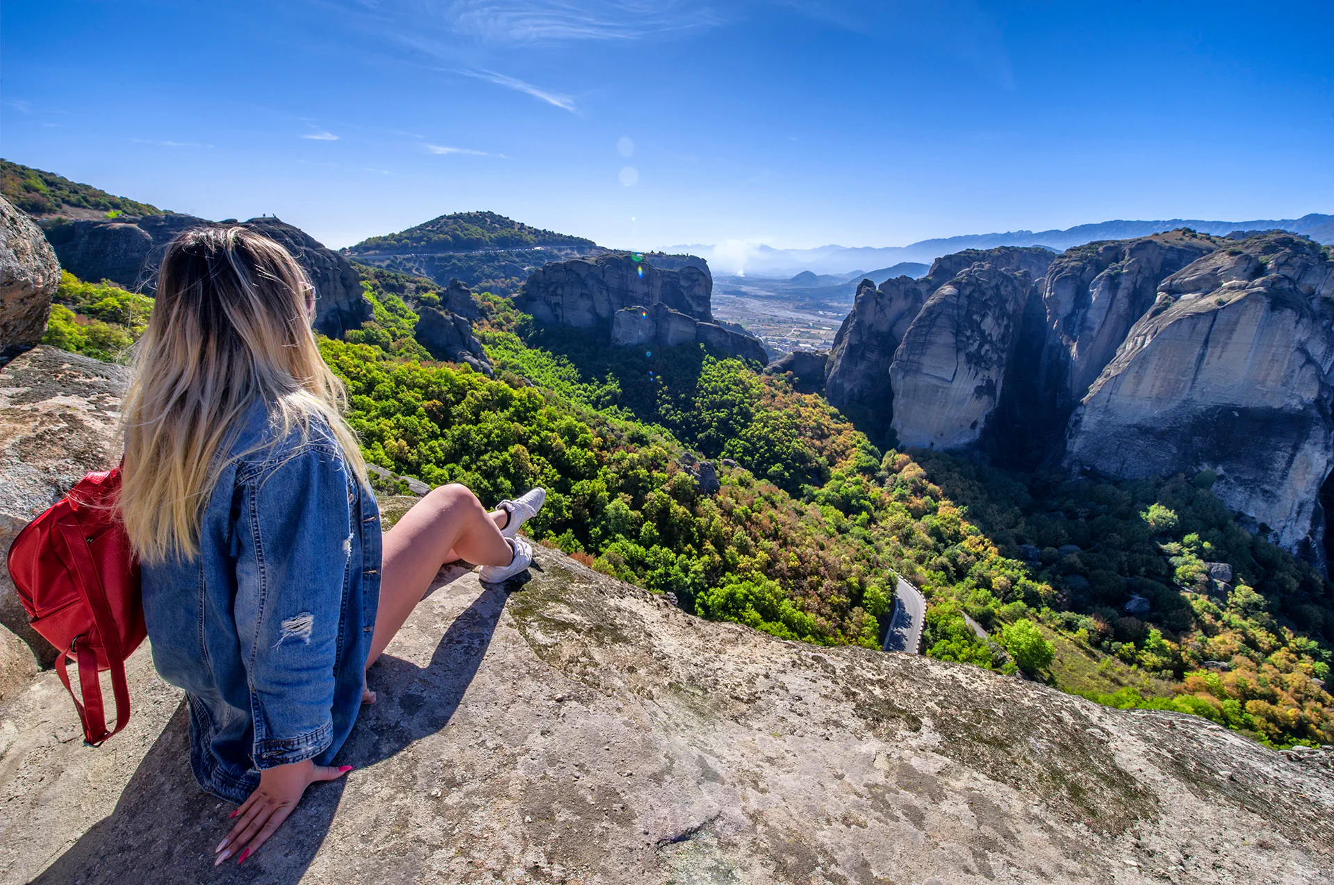 Panoramic landscape of Meteora’s stone pillars and mountains.