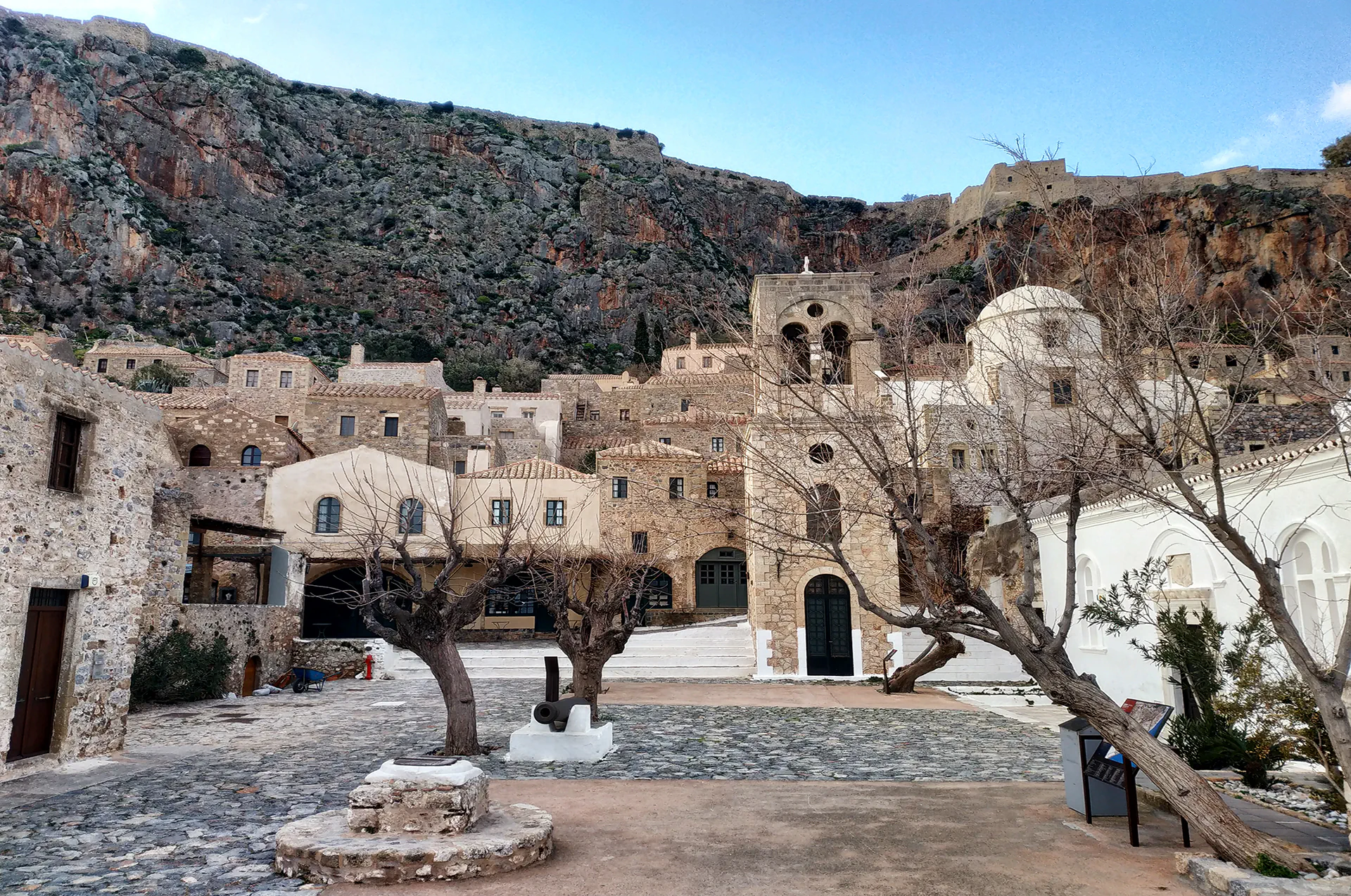 Historic bell tower beside a church in Monemvasia’s old town.