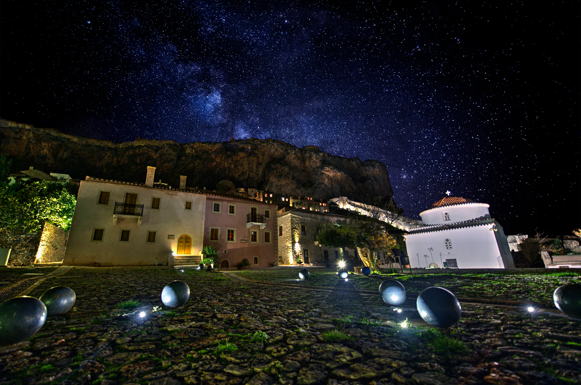 Romantic lantern-lit square in Monemvasia at night.