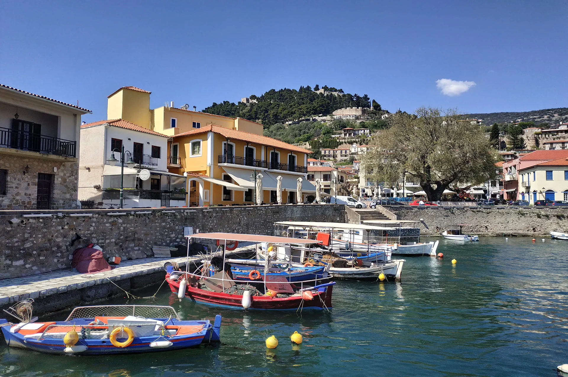 Local fishing boat docked in the calm waters of Nafpaktos port.