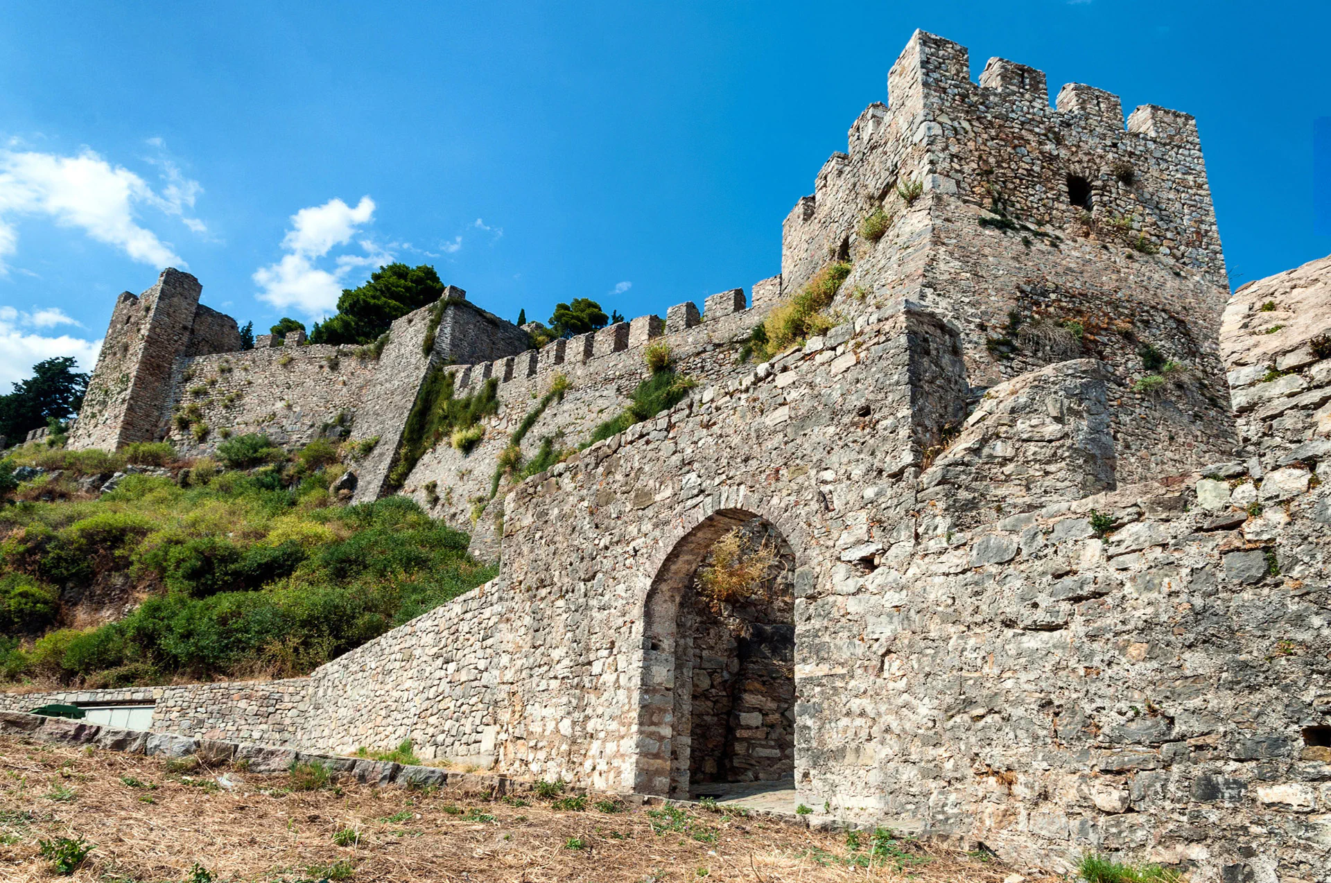 Fortress walls and towers of Nafpaktos Castle atop a hill