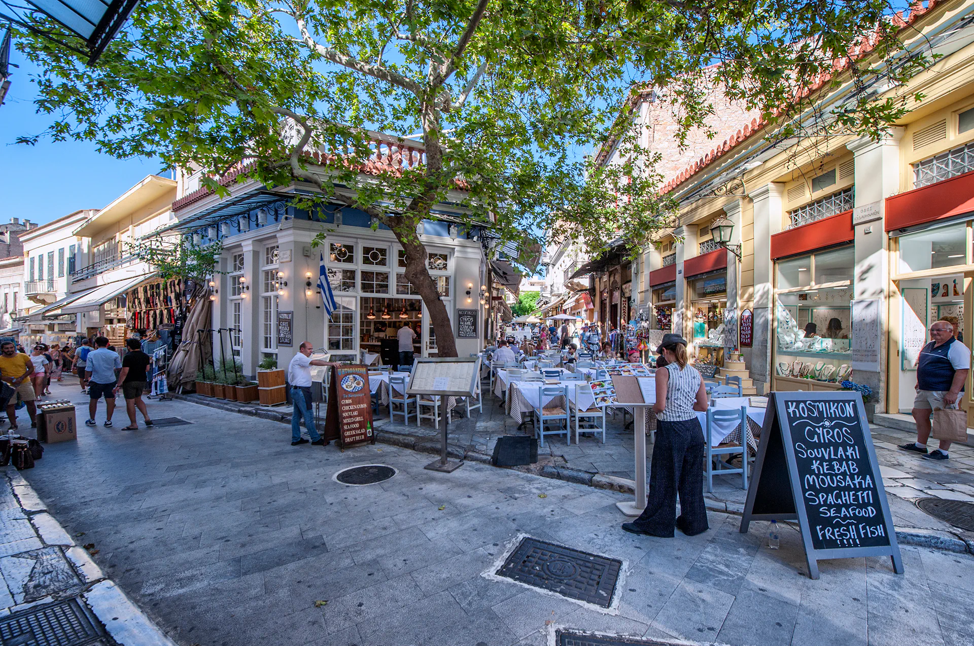 Traditional Greek taverna in Plaka, Athens with outdoor seating.