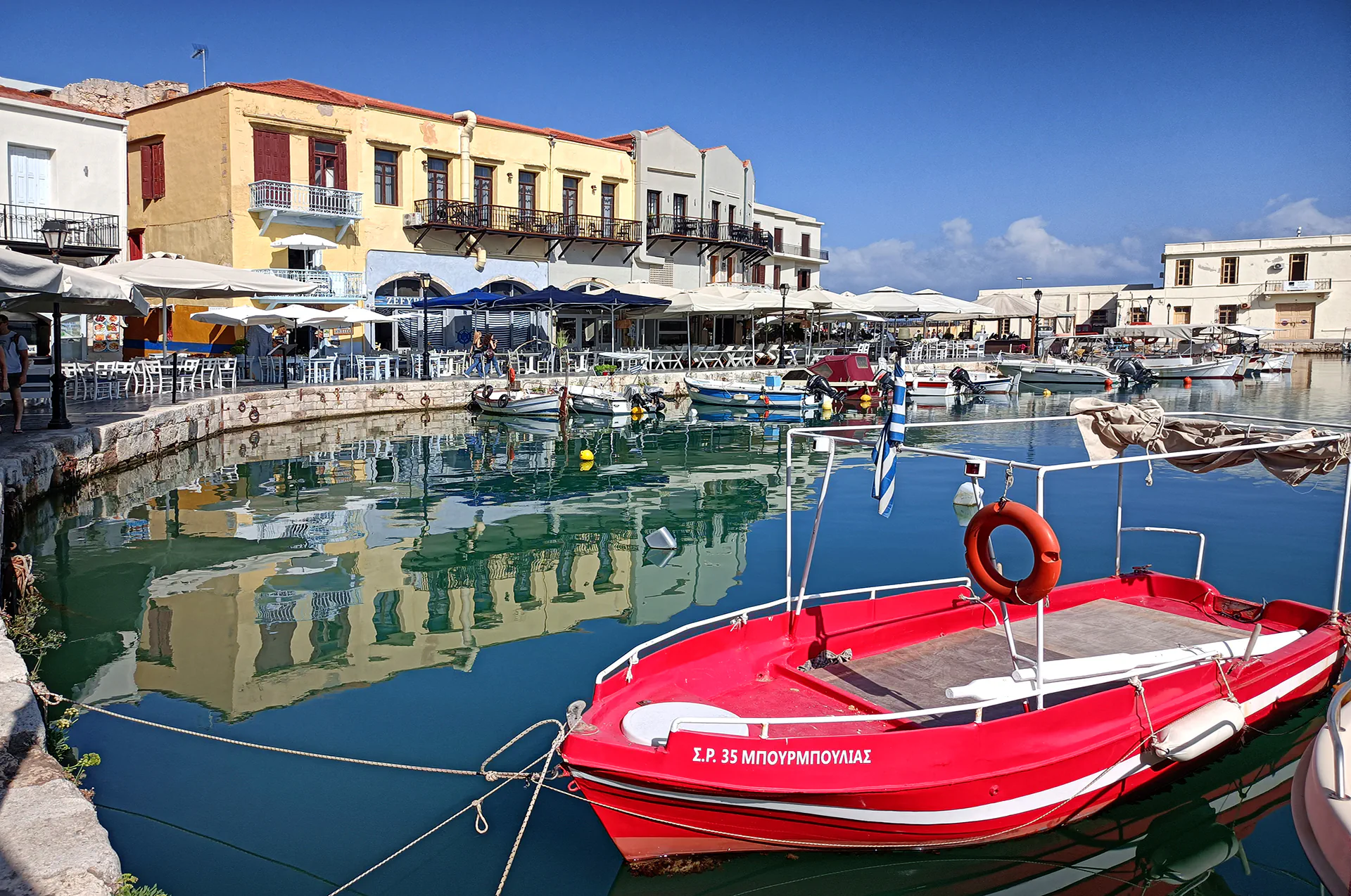 Colorful fishing boats in the Old Port of Rethymno, Crete