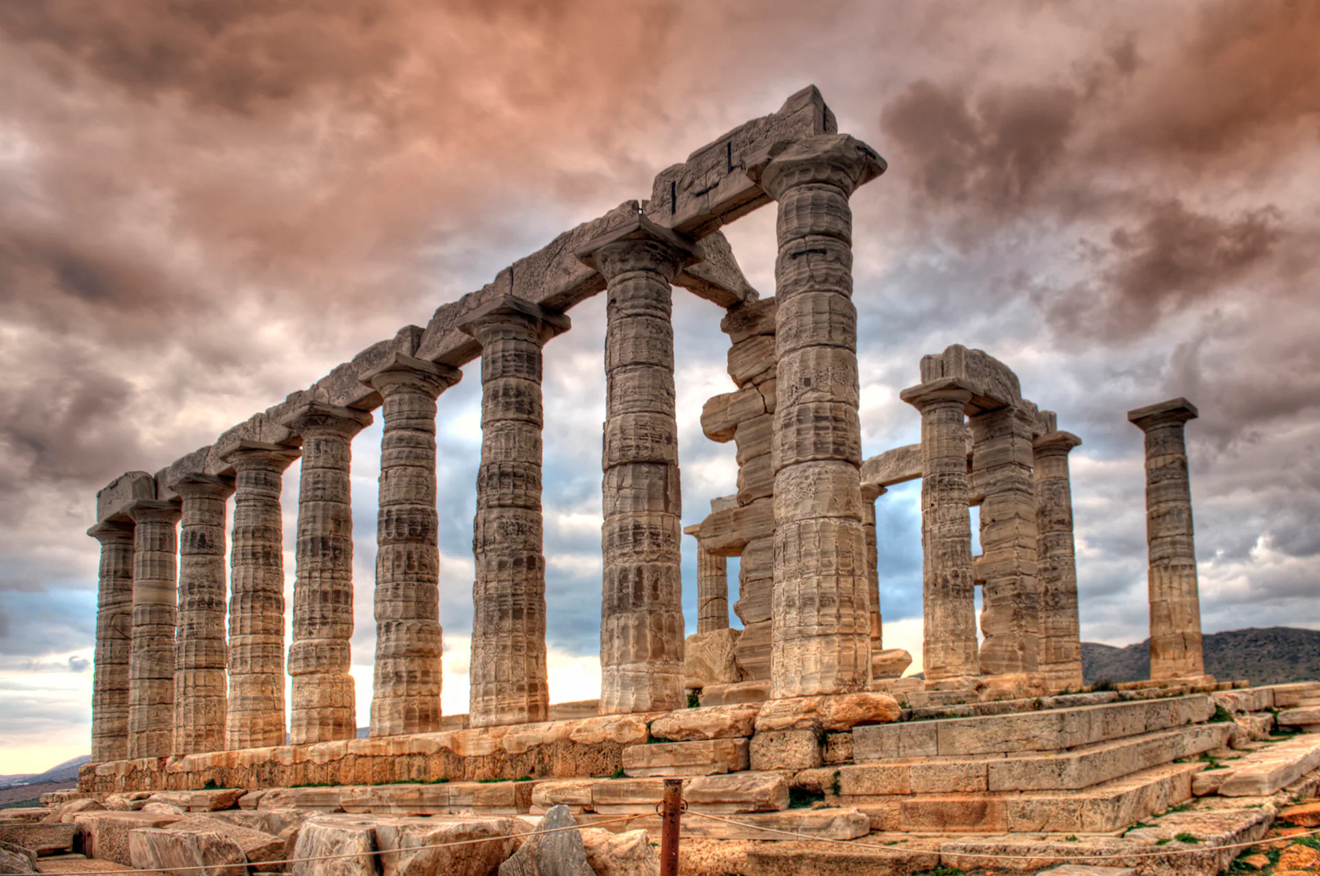 Temple of Poseidon in Sounio during a vibrant sunset.