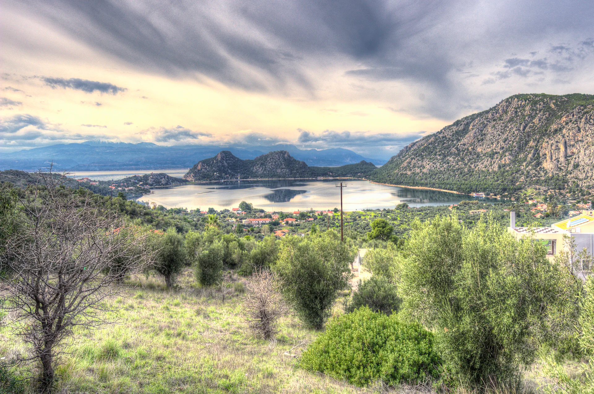 Aerial view of Vouliagmeni Lagoon in Perachora with turquoise water.